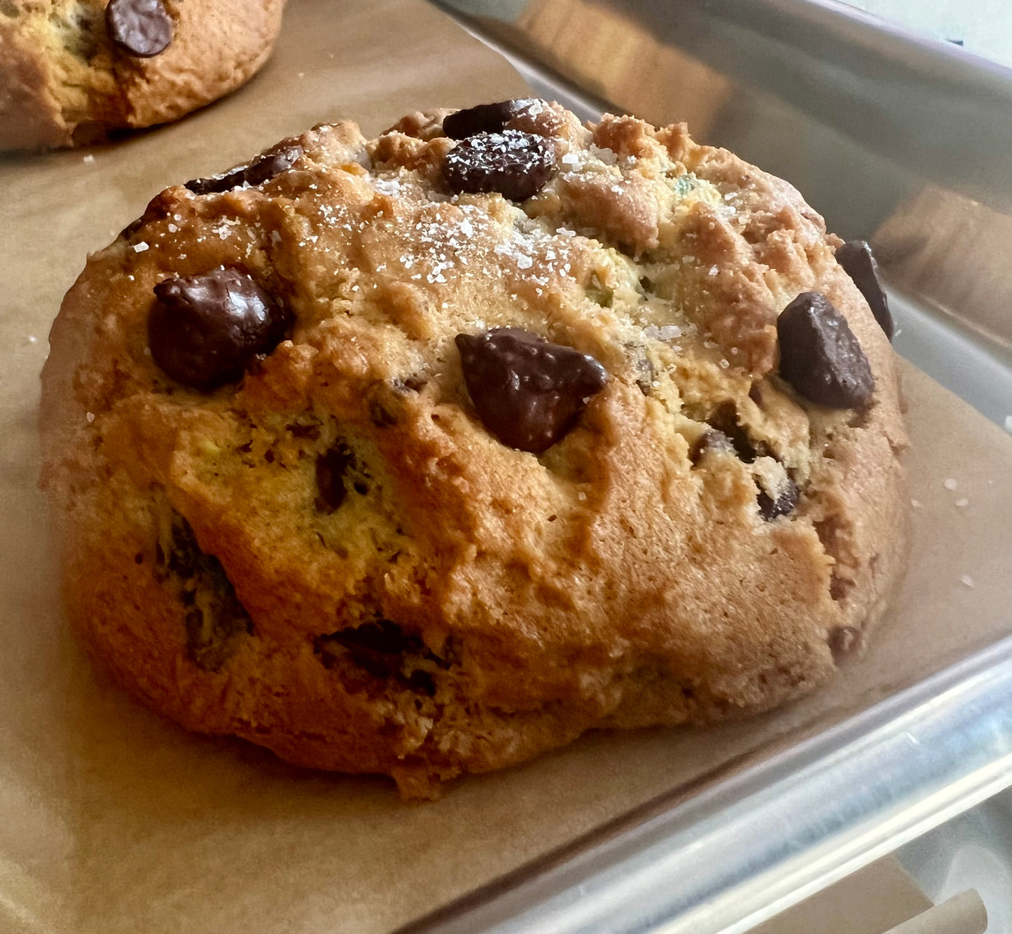 Salted dark chocolate pistachios cookies on cookie sheet.