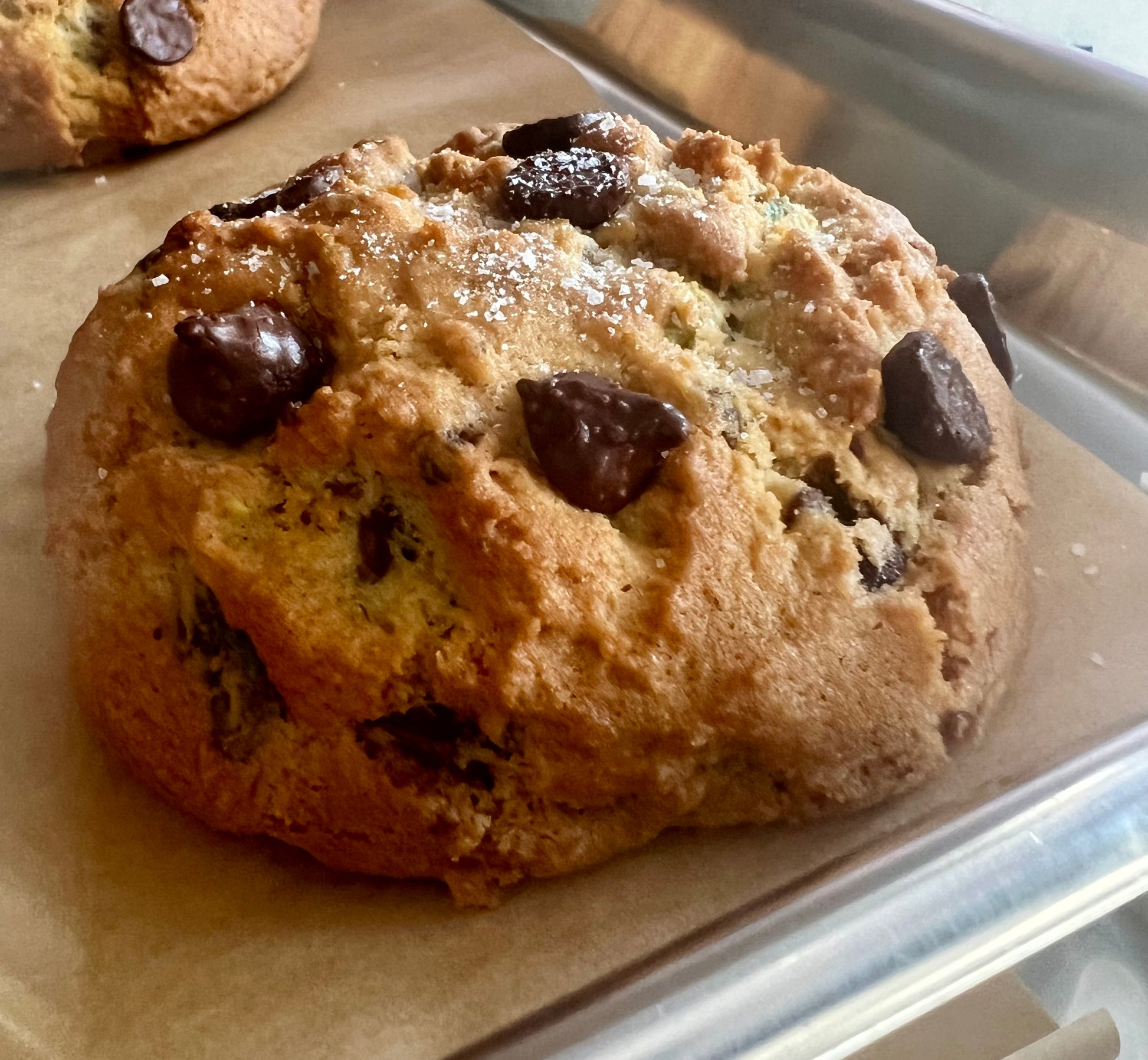 Salted dark chocolate pistachios cookies on cookie sheet.